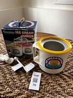 Ice cream maker components with original box visible