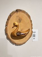 Full view of plaque with duck carving and scale card