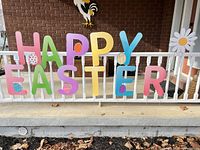 Foam core HAPPY EASTER letters displayed on porch railing