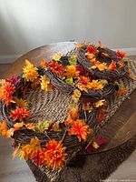 All three fall wreaths on table showing sizes and decorations