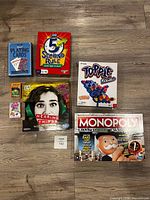 Full view of all seven game boxes on floor