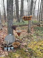 Full lot showing bird bath, baskets, shears, barrel rings, shepherd’s hook and galvanized pots