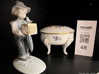 Side view of figurine next to trinket box, overall lot