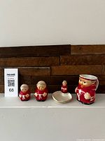 Full lot showing creamer, two shakers and ring dish