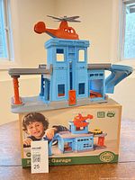 Assembled parking garage with helicopter on rooftop displayed on original box