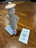 Full view of carved Scotsman figure standing on table