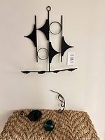 Overall lot: wall candle holder mounted above three accessory pieces