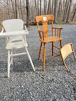 front view of both wooden toddler high chairs and detached tray
