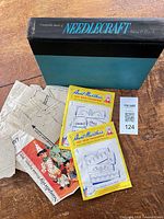 Cover of Good Housekeeping book, two sealed Aunt Martha transfers, Simplicity pattern pieces and envelope