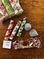 bag of eighteen M&M Minis Christmas canisters, two silver mini trees, four loose canisters, pink flower lights bundle