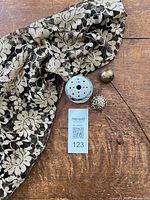 Overall lot showing shawl, ceramic holder and hat pins