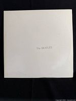 Front of white embossed album cover