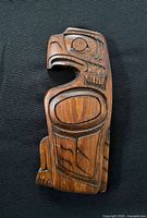 front view of carved eagle plaque