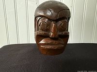 Front view of carved wooden mask