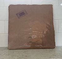 Original brown paper bag outer sleeve front