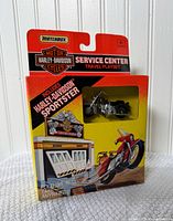 Front of boxed Matchbox Harley-Davidson Service Center Travel Playset showing motorcycle and graphics