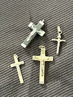 Group shot of four crucifix pendants