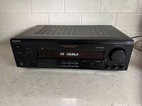 Front angled view of Sony STR-D360Z receiver powered on