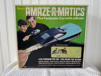 Front of Amaz-A-Matics box showing product graphics and branding