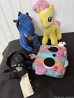Group shot of four plush toys