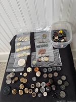 Overview of all buttons, resealable bags, plastic tub and loose groups