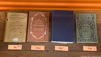 Front covers of four vintage books laid side by side