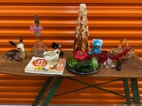 assorted vintage decor items on folding table