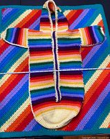 Blanket and bunting bag laid flat showing colours and design