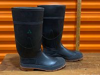 Side view of both boots showing height, outsole, and green CSA triangle