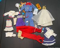 Overview of all Barbie clothes and accessories spread out