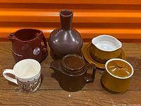 Group view of all six ceramic items