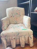Front view floral armchair showing cushion wear
