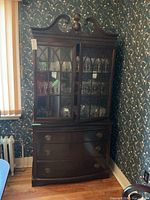 Full view of assembled two-piece china cabinet in corner