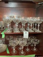 Wine glasses and margarita glasses on shelves