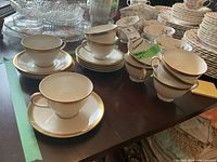 Stacked Royal Doulton Clarendon teacups and saucers on table
