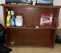 Front view of brown wood shelf with two tiers