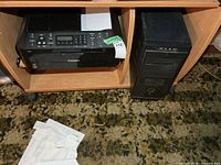 Canon Pixma MX410 printer and computer tower in cabinet