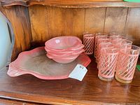 Bowls, tray, and tumblers on shelf