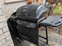 Full view of Char-Broil propane grill with side shelf and cart