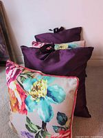 Side view showing both floral and purple cushions