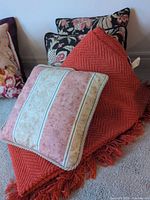 All items grouped: throw draped, three cushions visible