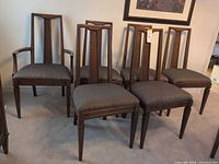 Six matching dining chairs, one with arms, grouped