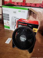 Honeywell fan in front of AirCare humidifier box
