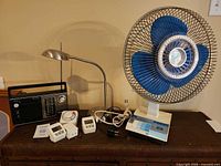 Overall lot showing fan, lamp, radio, timers