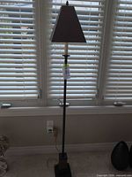 Full view of floor lamp showing height, pole, shade, cord