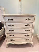 Full view of nightstand showing all five drawers, color and hardware