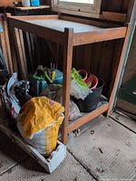 Wood two-level potting table with items stored below