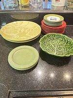 Group view showing serving plates, side plates, sandwich plates, appetizer plate stack, cabbage bowl