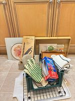 All items grouped: tray, recipe box, decorator, cutting boards, oven mitts, cooling rack, bin, bags