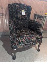 Front view of floral wingback chair